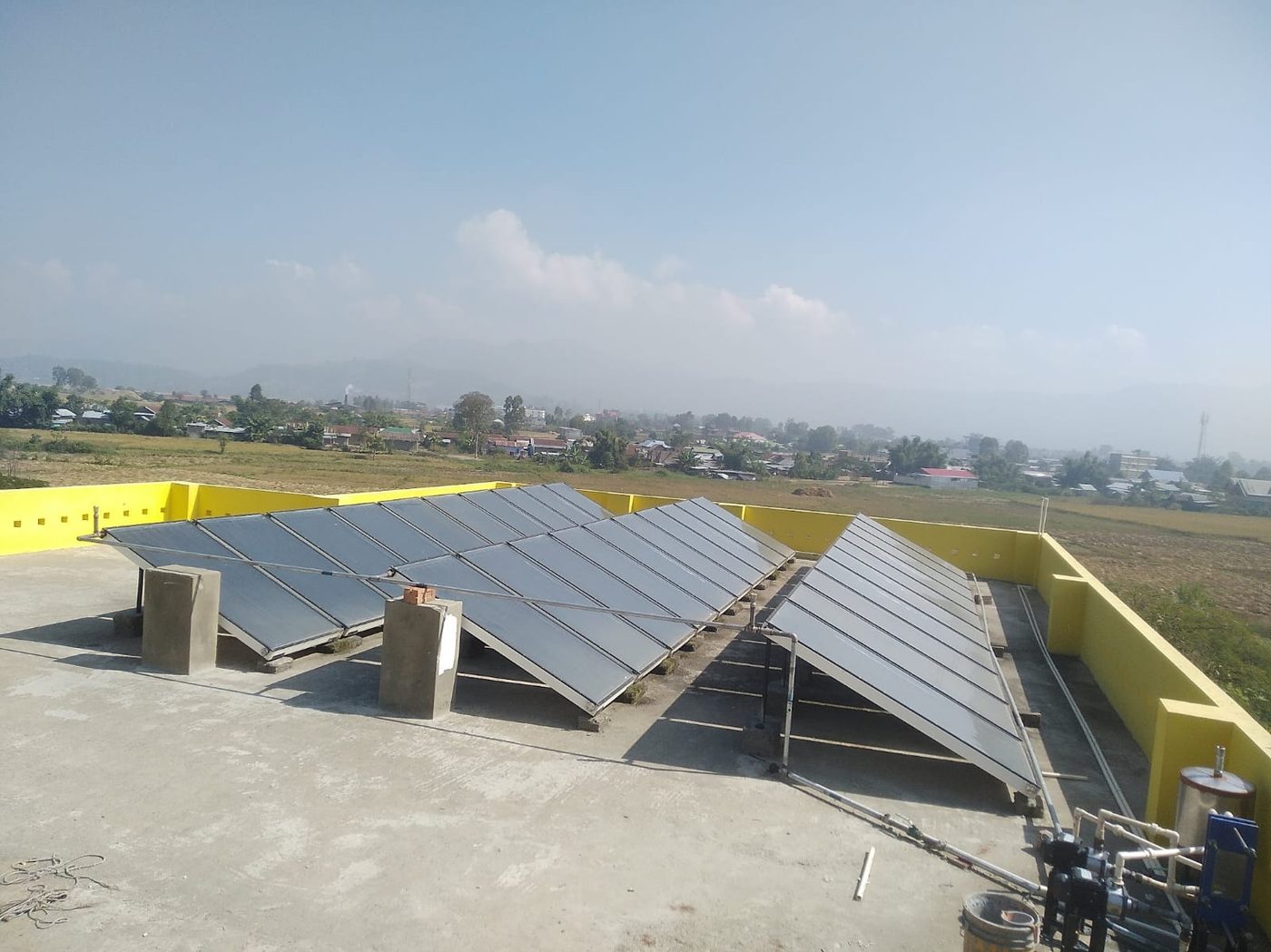 Bank of solar water heating collectors on a rooftop